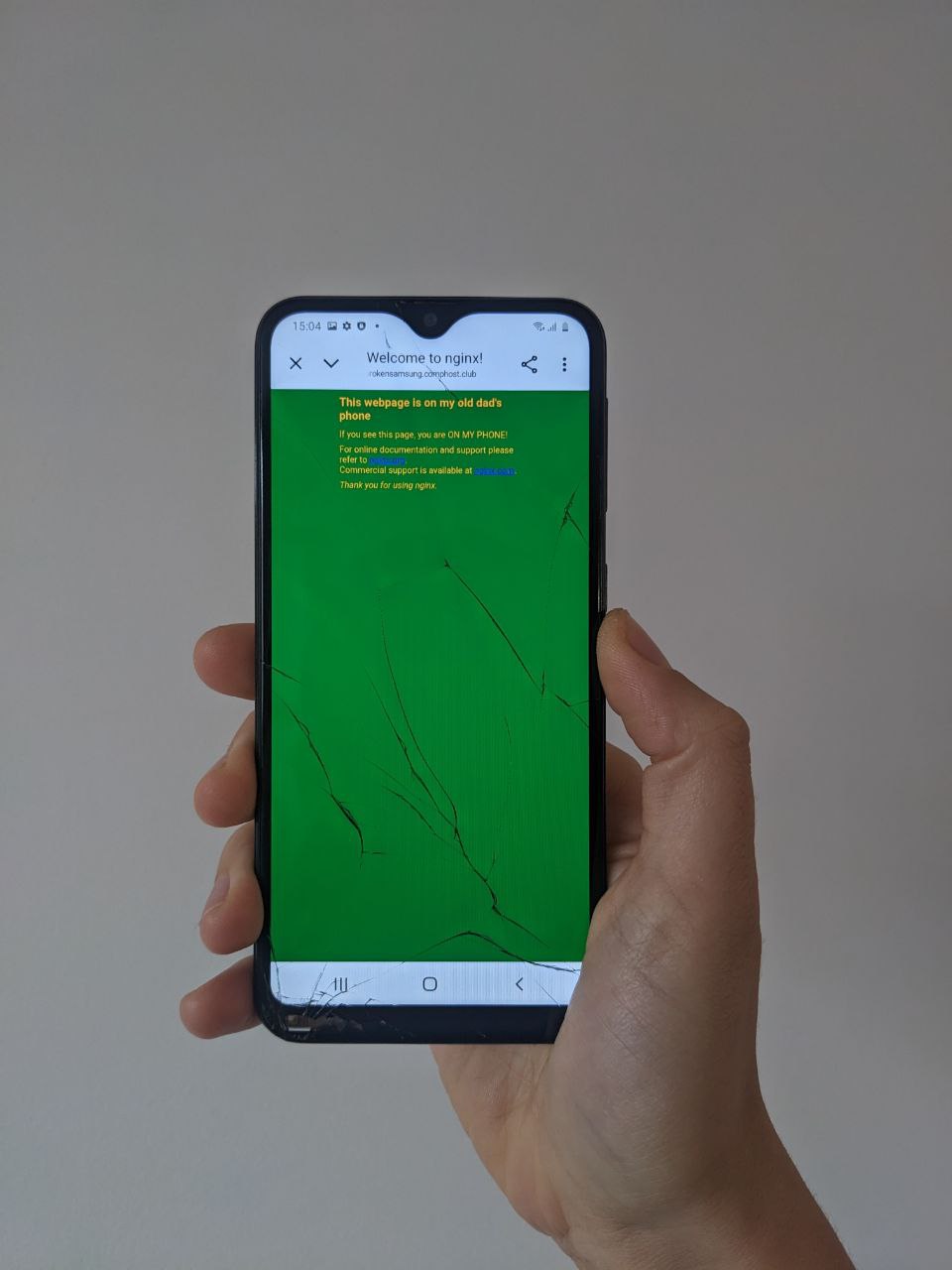 A phone showing our webpage hosted at brokensamsung.comphost.club